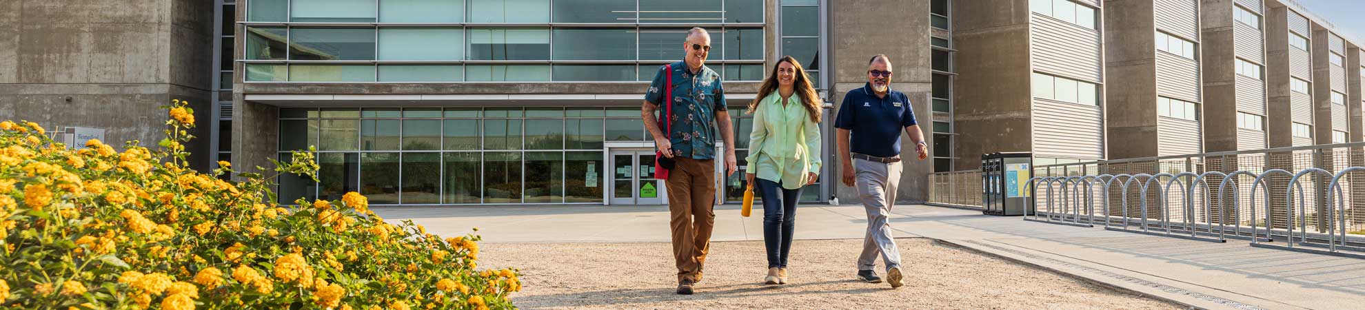 faculty members walking outside of the new HSRI building