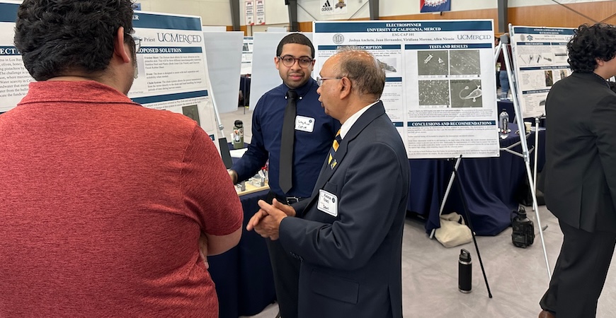 School of Engineering Dean Rakesh Goel speaks with students at the Innovate to Grow event.
